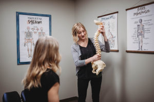 Dr. Lindsey demonstrating with a model spine.